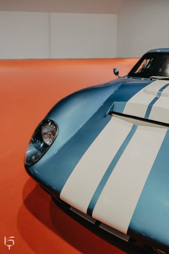 a blue and white car with white stripes